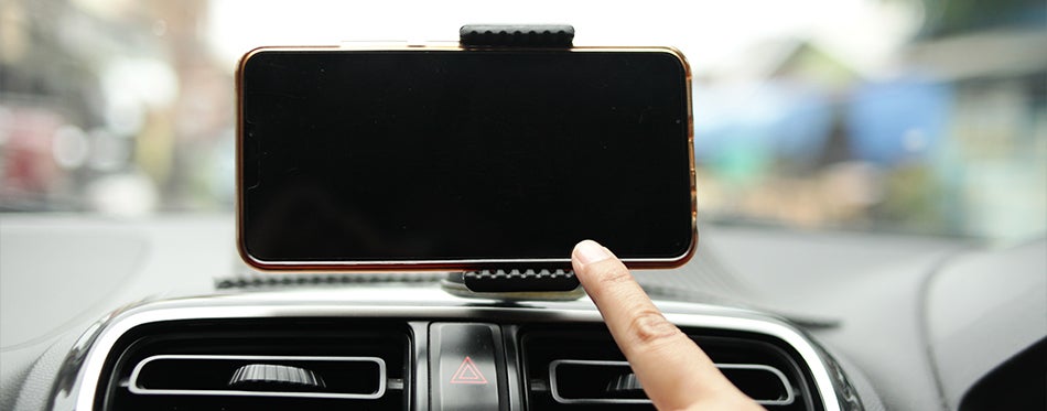 Tablet holder on car dashboard